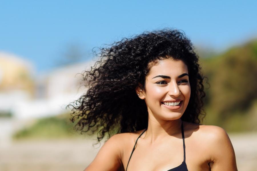 Curly girl at the beach