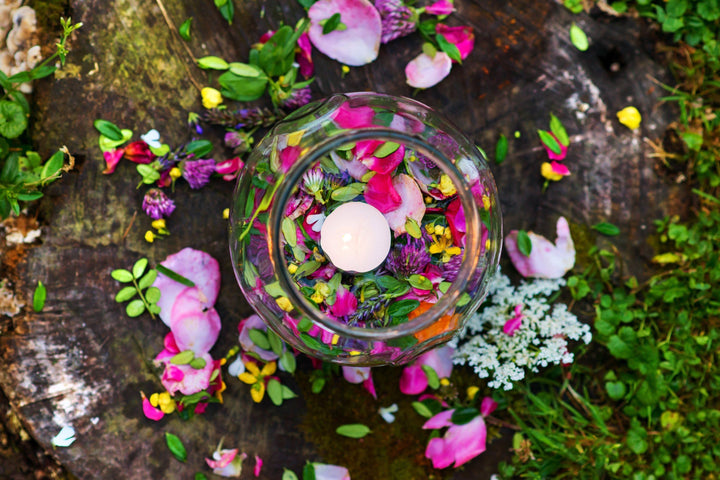 Water with petals and candle for aromatherapy