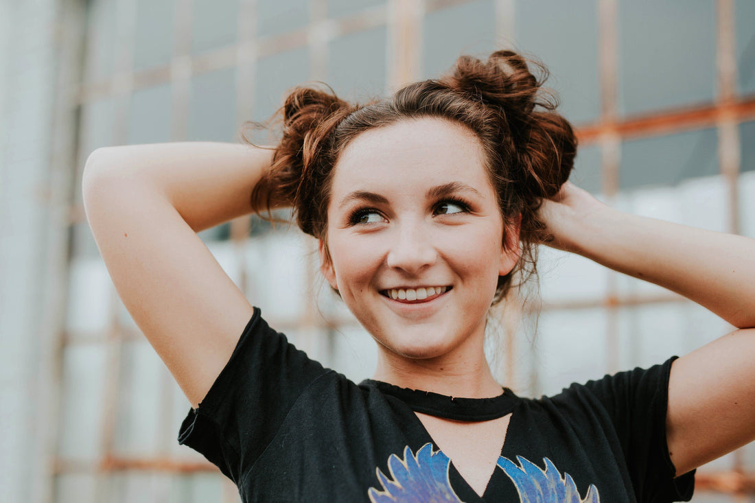Girl with her hair in buns
