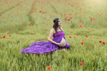 Pregnant woman in the middle of a field